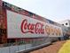 Large Coca-Cola mural on brick wall, part of the Roxy Theatre at 3300 Windy Ridge Se Pkwy # 1110, Atlanta, GA 30339