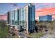Modern high rise building with glass exterior and parking at 3300 Windy Ridge Se Pkwy # 1110, Atlanta, GA 30339