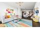 Open concept living area with a large sectional sofa and colorful rug at 3300 Windy Ridge Se Pkwy # 1110, Atlanta, GA 30339
