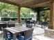 Outdoor patio with tables, chairs, and pergola at 3300 Windy Ridge Se Pkwy # 1110, Atlanta, GA 30339