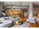 Open living space with hardwood floors, comfy seating, and a bedroom at 115 W Peachtree Nw Pl # 301, Atlanta, GA 30313