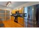 Modern kitchen with stainless steel appliances and wood cabinets at 115 W Peachtree Nw Pl # 301, Atlanta, GA 30313