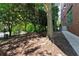 Shaded dog park with waste disposal and benches at 115 W Peachtree Nw Pl # 301, Atlanta, GA 30313