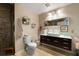 Spa-like bathroom with walk-in shower, pebble floor, and floating vanity at 115 W Peachtree Nw Pl # 301, Atlanta, GA 30313
