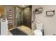Bathroom with walk-in shower, pebble floor and shelving at 115 W Peachtree Nw Pl # 301, Atlanta, GA 30313
