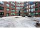 Shared courtyard with seating area for residents at 115 W Peachtree Nw Pl # 301, Atlanta, GA 30313