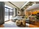 L-shaped sectional sofa, gold accent tables and hardwood floors at 115 W Peachtree Nw Pl # 301, Atlanta, GA 30313