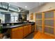 Modern kitchen with wood cabinets, granite countertops, and stainless steel appliances at 115 W Peachtree Nw Pl # 301, Atlanta, GA 30313