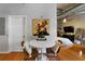 Small dining area with white table and two brown chairs at 115 W Peachtree Nw Pl # 301, Atlanta, GA 30313