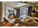 Bright and airy living room with hardwood floors and city views at 115 W Peachtree Nw Pl # 301, Atlanta, GA 30313