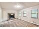 Living room featuring a stone fireplace and neutral carpeting at 34 Powder Brook Ct, Dallas, GA 30157