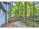 Wooden deck overlooking a wooded backyard at 34 Powder Brook Ct, Dallas, GA 30157