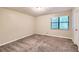 Spacious bedroom with neutral walls and carpet at 34 Powder Brook Ct, Dallas, GA 30157