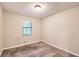 Well-lit bedroom with neutral walls and carpet at 34 Powder Brook Ct, Dallas, GA 30157