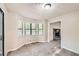 Bright dining room with bay window and view into living room at 34 Powder Brook Ct, Dallas, GA 30157