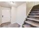 Simple entryway with carpeted floor and staircase at 34 Powder Brook Ct, Dallas, GA 30157