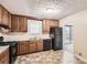 Bright kitchen with ample cabinetry, gas range, and access to a back patio at 34 Powder Brook Ct, Dallas, GA 30157
