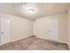 Well-lit bedroom with neutral walls and carpet at 34 Powder Brook Ct, Dallas, GA 30157
