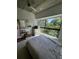 Bedroom with large window, carpeted floor, and ceiling fan at 563 Se Memorial Se Dr # 401, Atlanta, GA 30312