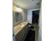 Bathroom with granite countertop, large mirror and walk-in closet at 563 Se Memorial Se Dr # 401, Atlanta, GA 30312
