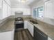 Renovated kitchen with granite countertops and stainless steel appliances at 1189 Ashborough Se Dr # K, Marietta, GA 30067