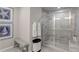 Large walk-in shower with gray tile and built-in bench at 5174 Longview Run, Decatur, GA 30035