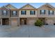 Three-unit townhome building with two-car garages at 1408 Creel Ln, Atlanta, GA 30349