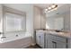 Relaxing bathroom with soaking tub and double vanity at 1408 Creel Ln, Atlanta, GA 30349