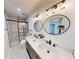 Updated bathroom with double vanity, marble shower, and modern fixtures at 2790 Miriam Ln, Decatur, GA 30032