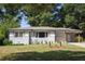 Charming ranch home with gray brick exterior and landscaped yard at 2790 Miriam Ln, Decatur, GA 30032