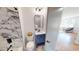 Modern bathroom with navy vanity, marble shower, and new fixtures at 2790 Miriam Ln, Decatur, GA 30032