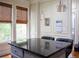 Kitchen features granite countertop island with black leather stools at 9931 Mancunian Way, Douglasville, GA 30135