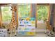 bedroom with bookshelf and stuffed animals at 9931 Mancunian Way, Douglasville, GA 30135