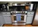 Stainless steel gas range and oven with granite countertops at 9931 Mancunian Way, Douglasville, GA 30135