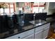 Modern kitchen features granite countertops, stainless steel appliances, and ample cabinet space at 9931 Mancunian Way, Douglasville, GA 30135