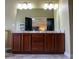 Double vanity bathroom with large mirror and hardwood floor at 9931 Mancunian Way, Douglasville, GA 30135