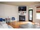 Living room features hardwood floors, fireplace, and access to backyard at 9931 Mancunian Way, Douglasville, GA 30135
