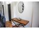 Bright entryway with wood floors and console table at 9931 Mancunian Way, Douglasville, GA 30135