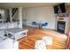 Open living area with hardwood floors, fireplace and ample natural light at 9931 Mancunian Way, Douglasville, GA 30135