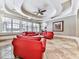 Bright sitting room, red leather sofas, tray ceiling, and hardwood floors at 404 Folsom Glade Rd, Rydal, GA 30171
