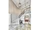 Grand entrance with a curved staircase and tile flooring at 404 Folsom Glade Rd, Rydal, GA 30171