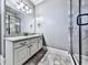 Bathroom with granite countertop, white cabinets and shower at 404 Folsom Glade Rd, Rydal, GA 30171