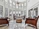 Relaxing sunroom filled with natural light and comfortable seating at 404 Folsom Glade Rd, Rydal, GA 30171