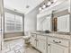 Bathroom with granite countertop, tiled floor, and updated vanity at 404 Folsom Glade Rd, Rydal, GA 30171