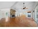 Bright living room featuring hardwood floors and a stone fireplace at 3573 Clubhouse Ln, Conyers, GA 30094