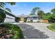 Newly renovated home with a spacious driveway and landscaping at 3573 Clubhouse Ln, Conyers, GA 30094