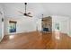 Spacious living room with hardwood floors, stone fireplace, and high ceilings at 3573 Clubhouse Ln, Conyers, GA 30094