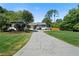 Newly painted home with a large driveway and manicured lawn at 3573 Clubhouse Ln, Conyers, GA 30094