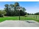 Outdoor basketball court with concrete pad and new goal at 3573 Clubhouse Ln, Conyers, GA 30094