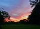 Peaceful sunset view over the neighborhood at 3573 Clubhouse Ln, Conyers, GA 30094
